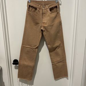 LEVIS JEANS WITH UNIQUE DISTRESSED POCKET HOLES
